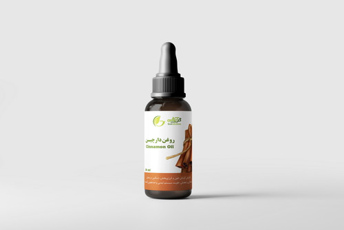 روغن گیاهی دارچین در ظرف قطره چکان شیشه ای قهوه ای