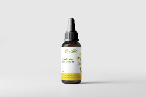 روغن گیاهی بابونه در ظرف قطره چکان شیشه ای قهوه ای
