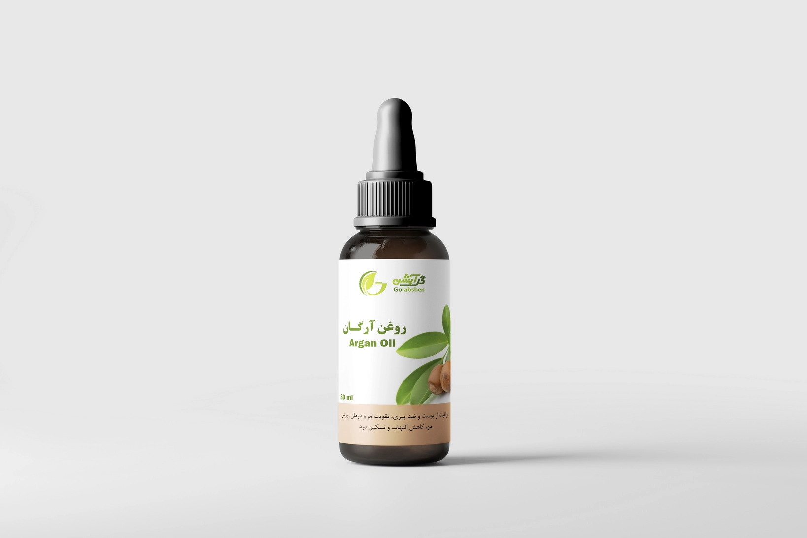 روغن گیاهی آرگان در ظرف قطره چکان شیشه ای قهوه ای