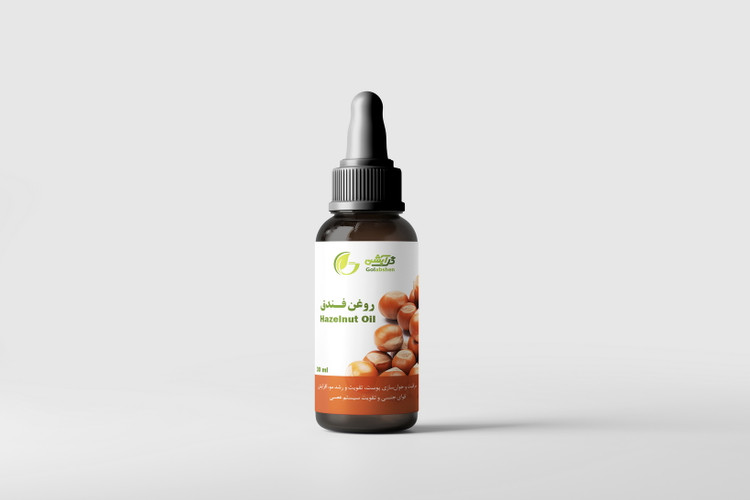 روغن فندق در ظرف قطره چکان شیشه ای قهوه ای