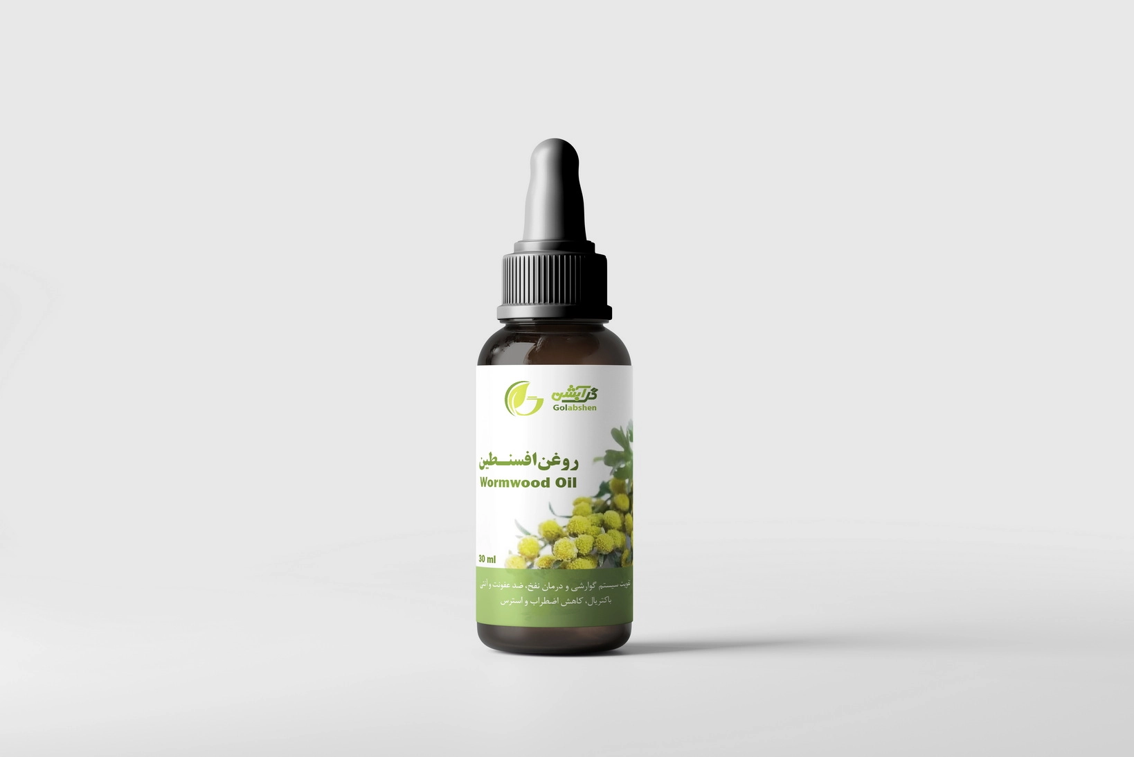 روغن افسنـطین در ظرف قطره چکان شیشه ای قهوه ای